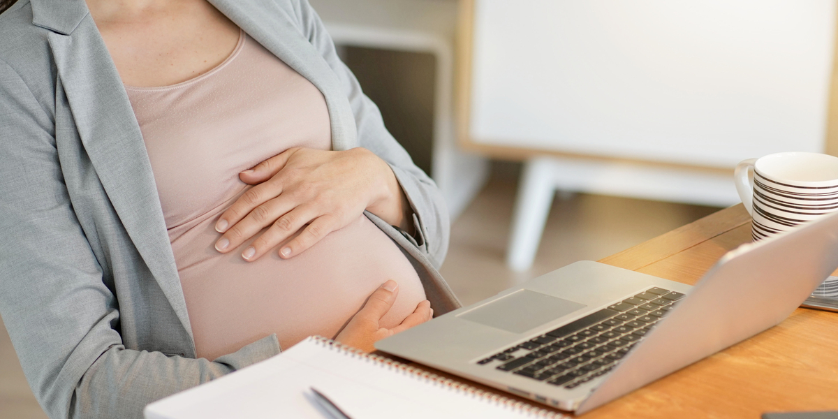 Pregnant professional woman at work