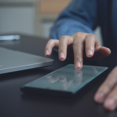 man digitally signing on phone